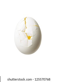Close-up Of Cracked Egg Isolated Over White Background