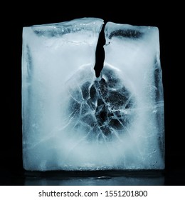 Closeup Of Cracked Ice Texture On An Ice Cube. Studio Macro Shot.