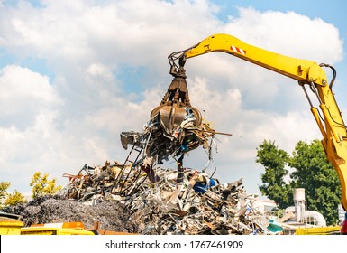 Close-up of a crane for recycling metallic waste on scrapyard - Shutterstock ID 1767461909
