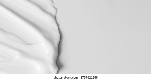 Close-up cream moisturiser smear smudge wavy texture on white background with copy space horizontal banner format. Skin care beauty product - Shutterstock ID 1759621289