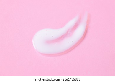 Close-up Cream Moisturiser Smear Smudge Wavy Texture On Pink. Background With Copy Space Horizontal Banner Format. Skin Care Beauty Product