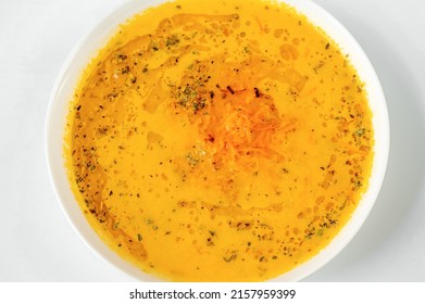 Closeup Creamy Carrot Soup In White Plate.