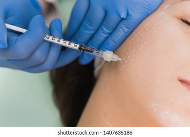 Closeup Cropped Image Of Doctor's Hands Doing Facial Mesotherapy On Beautiful Woman