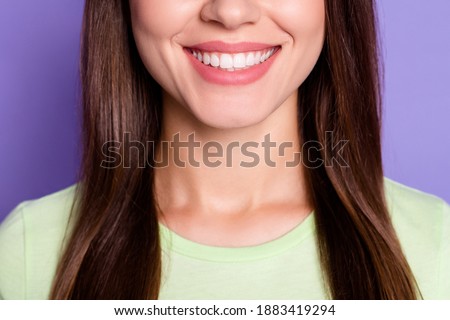 Closeup cropped photo of beautiful woman with brunette hair smiling with white teeth isolated on bright violet color background