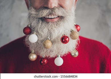 Closeup cropped photo concept of old positive santa claus man colorful toy balls in long beard x-mas decorations wear red pullover hipster outfit isolated grey color wall background