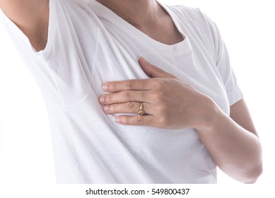 Closeup cropped portrait young woman with breast pain touching chest isolated on background