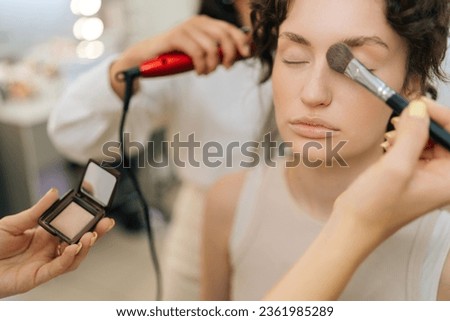 Similar – Image, Stock Photo Cropped unrecognizable female hairstylist using electric trimmer on male client’s hair at salon