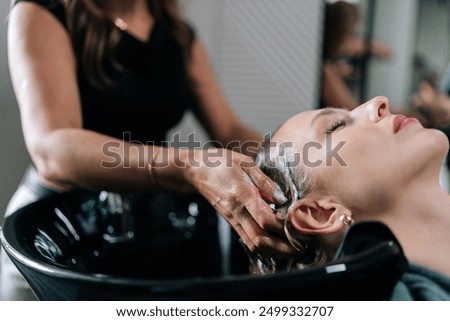 Similar – Image, Stock Photo Cropped unrecognizable female hairstylist using electric trimmer on male client’s hair at salon