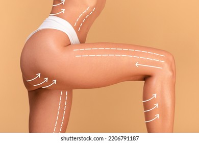 Closeup Cropped Shot Of Young Woman In White Panties Posing With Massage Lines And Arrows On Her Body, Isolated On Beige Studio Background, Panorama, Free Space