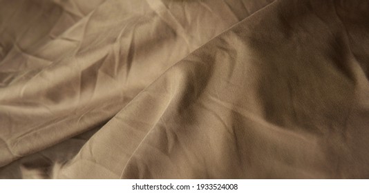 Closeup Crumpled Or Creased Brown Color Rough Bed Sheet Texture Background