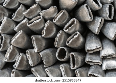 Close-up of crushed aluminum scrap, discarded metal ready for recycling at an industrial scrap yard - Powered by Shutterstock