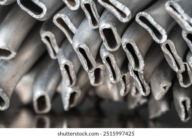 Close-up of crushed aluminum scrap, discarded metal ready for recycling at an industrial scrap yard - Powered by Shutterstock