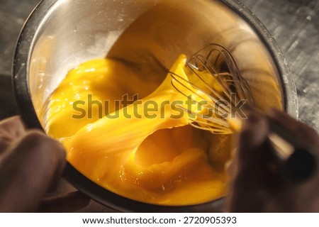 Closeup of culinary prep showcasing flowing egg mixture