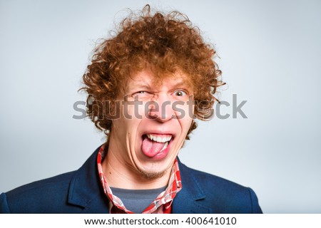 closeup curly man squeamish, isolated on background