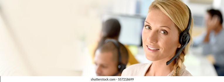 Closeup Of Customer Service Manager Standing In Call Center 