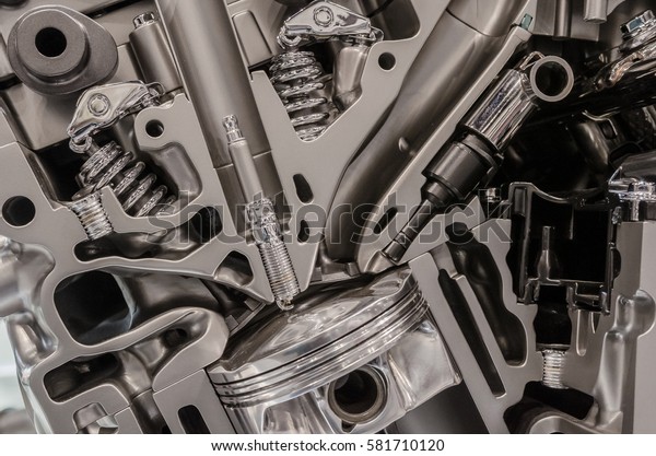 Close-up cutaway of \
combustion engine