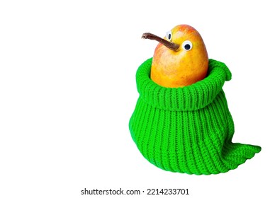 Close-up Of A Cute Anthropomorphic Pear With Googly Eyes Placed Inside A Green Knitted Pouch Isolated On White Background With Copy Space. Stylish Way To Stay Warm In Winter.