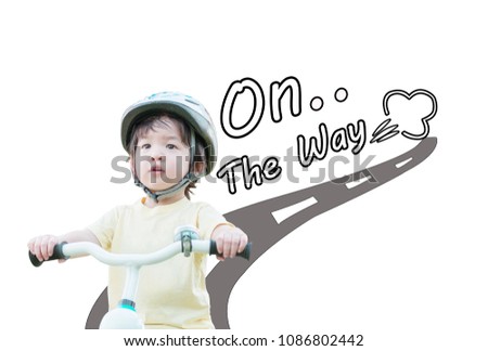 Closeup cute asian kid ride a bike with on the way word isolated on white background