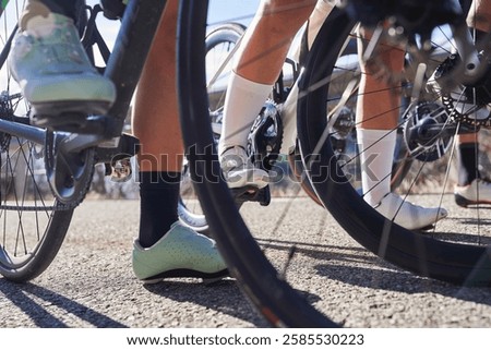 Close-up of cyclists' feet on clipless pedals during a road biking stop