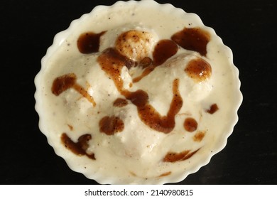 Closeup Of Dahi Bhalle With Black Background 