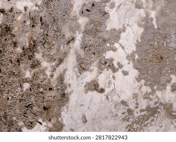 A close-up of a damaged wall texture with flaking paint, rough cement exposure, and subtle mold spots, giving an old industrial vibe.