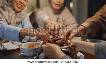 Close-up dates fruit dish Eid Mubarak Muslim Asia family have Iftar dinner to break feast. Traditional food during Ramadan fasting month at home, The Islamic Halal Eating and Drinking at modern Islam.