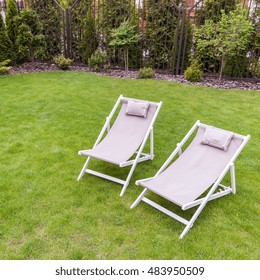 Close-up of deck chairs in the garden