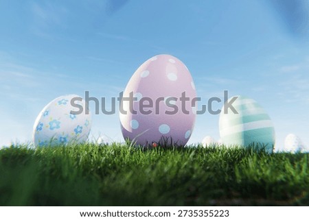 Close-up of decorative Easter eggs with pastel polka dots and floral patterns in green grass. Egg with clear blue sky background, perfect for spring holiday designs.