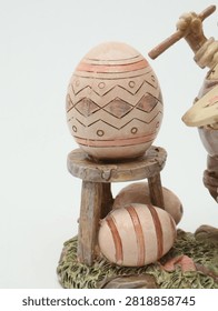 Close-up of decorative painted Easter eggs on a wooden stool figurine