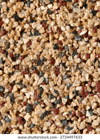 Close-up of Decorative Pebble Dash Wall Finish with Mixed Natural Stones
Macro View of Granite and Quartz Gravel Epoxy Floor Coating
Abstract Multi-Colored Crushed Stone Mosaic Pattern for Constructio
