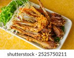 Closeup Deep fried duck beaks and deep fried isoletion and clippingpath.Popular snacks for Thai and Chinese people