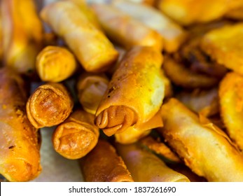 Closeup Of Deep Fried Jalapeno Cheese Sticks Made With Spring Roll Wrapper On A Glass Plate.