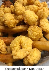 Closeup Of Deep Fry Popcorn Shrimp And French Fries.