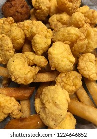 Closeup Of Deep Fry Popcorn Shrimp And French Fries.