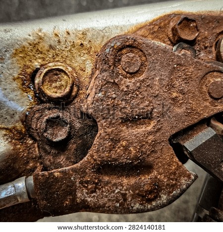Close-up of deep rust damage from winter road salt. automotive metal surface background