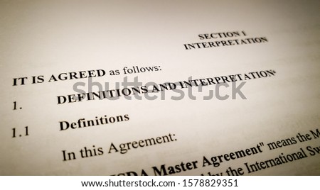 Closeup of the Definitions and Interpretations section of a generic agreement, concept