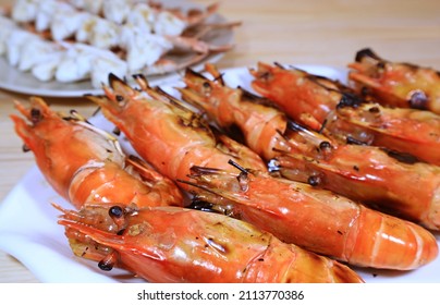Closeup of Delectable Flaming Grilled River Prawns on a White Plate - Shutterstock ID 2113770386