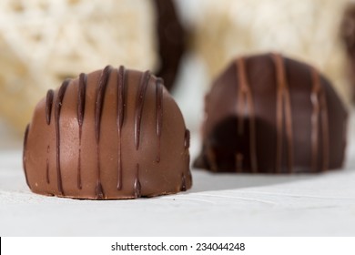 Closeup of delicious chocolates with milk