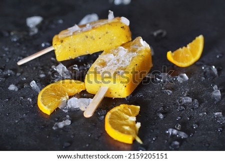 A closeup of delicious mango, passion fruit, strawberry and orange icepops