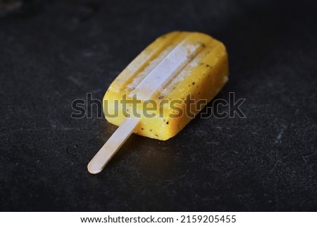 A closeup of delicious mango, passion fruit, strawberry and orange icepops