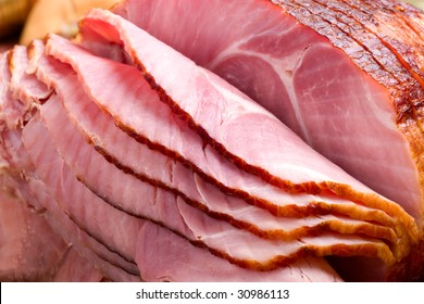 Closeup Of Delicious Whole Baked Sliced Ham With Fresh Strawberries And Figs On Holiday Table.