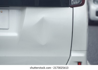 Closeup Dent Of Car Rear Bumper