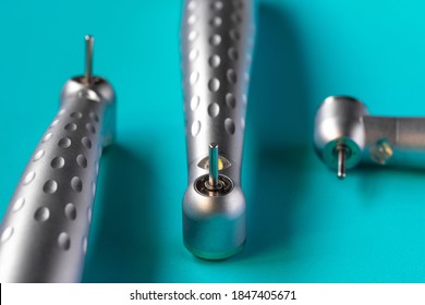 Closeup of dental high-speed handpieces on the blue background