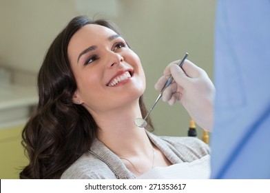 Closeup of dentist examining young woman's teeth
 - Powered by Shutterstock