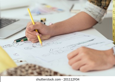 Close-up Of Designer Drawing A Fashion Sketch