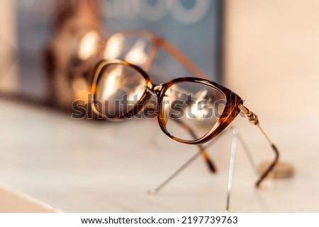 Close-up, designer glasses inside a shop window