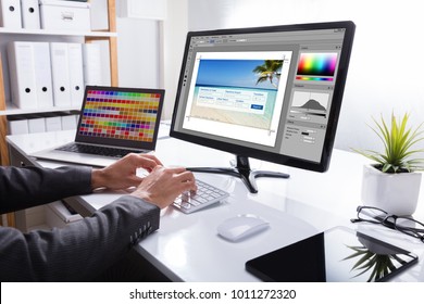 Close-up Of A Designer's Hand Editing Photo On Computer In Office - Powered by Shutterstock