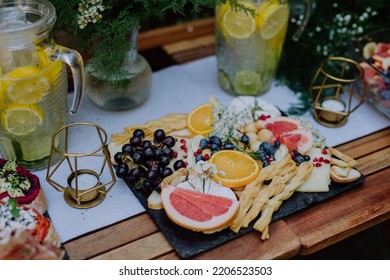 Close-up Of Dessert Buffet At Small Wedding Reception Outside In The Backyard.