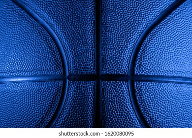 Closeup Detail Of Basketball Ball Texture Background. Blue Neon Banner Art Concept