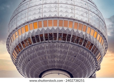 Close-up - Detail of the Berlin TV Tower at Alexanderplatz in Berlin Mitte with dramatic sunset sky